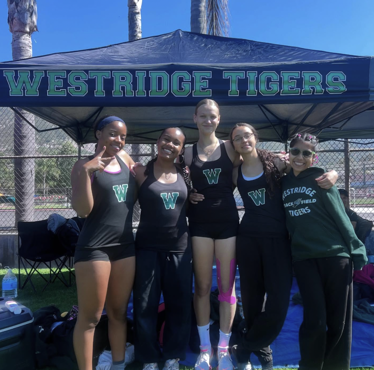 Bennett T. and Micaela R. stand alongside other Tiger athletes at D4 Prelims at Carpinteria High School.